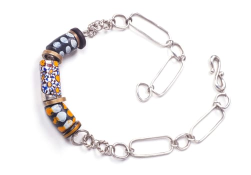 Close up of silver and painted stone necklace isolated on white background, manufactured by Ornella Salamone