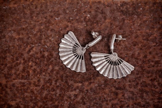 Close up of silver earrings, manufactured by Ornella Salamone