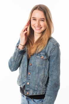 Girl in jeans on the phone with a mobile phone