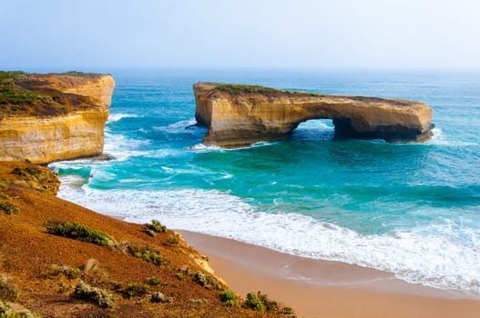 London Bridge at The Twelve Apostles, a famous collection of limestone stacks off the shore of the Port Campbell National Park, by the Great Ocean Road in Victoria, Australia