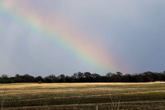 Nature Rainbow over pretty green Nebraska landscape. High quality photo