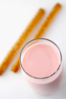 High angle view of a milkshake with two breadsticks