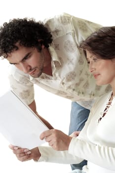 Close-up of a young woman showing documents to a young man