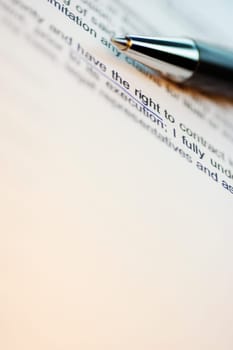 Close-up of a pen on a printed document