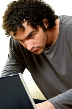 Close-up of a young man using a laptop