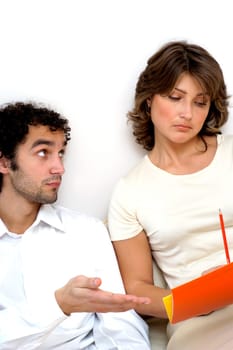 Close-up of a young man looking at a young woman