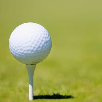 Close-up of a golf ball on a tee
