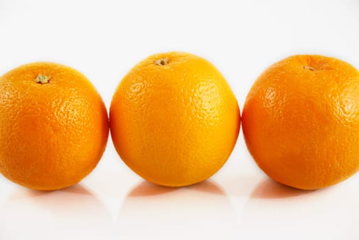 Close-up of three oranges