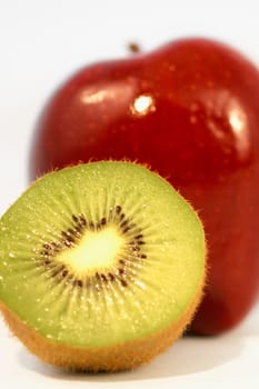 Close-up of half a kiwi and an apple