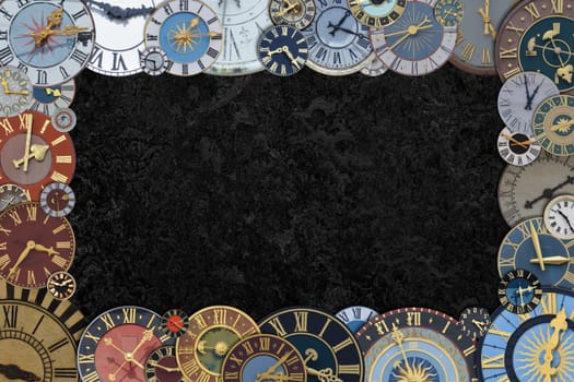 frame out of a collection of multicolored ancient church tower clocks in different sizes and forms with roman numbers around black copy space in the middle