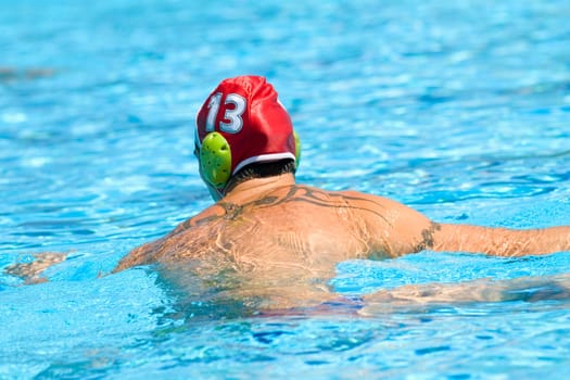 Rear view of a mid adult man in a swimming pool