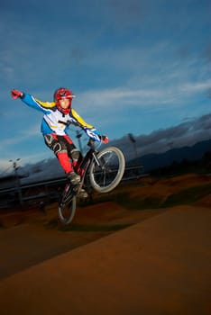 Teenage boy performing a stunt on a bicycle