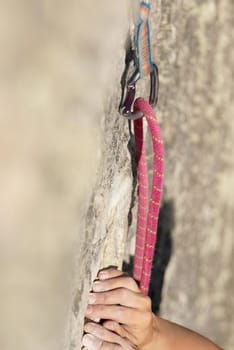 Close-up of a climberŽs hands gripping a rock