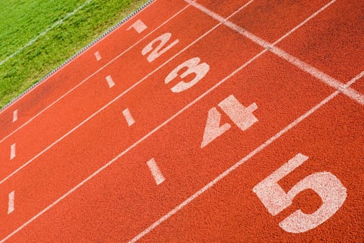 Close-up of track numbers on a running track