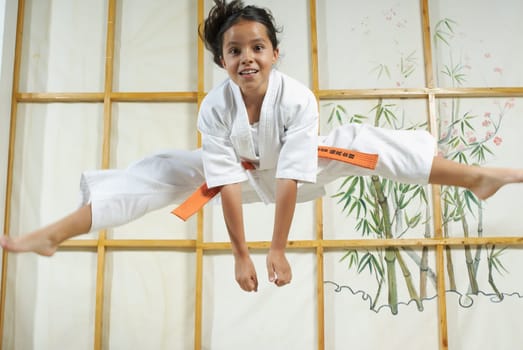 Portrait of a girl practicing karate and smiling