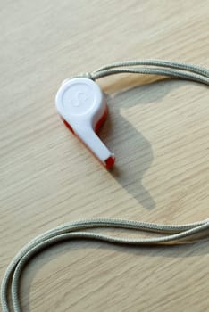 Close-up of a whistle with a cord