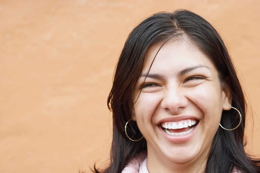 Close-up of a young woman laughing