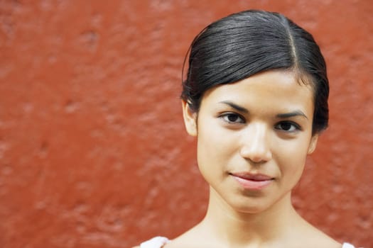 Portrait of a young woman smirking