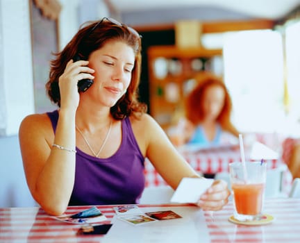 Close-up of a young woman talking on a mobile phone, Bermuda