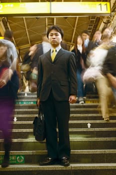 Low angle view of a businessman standing on steps