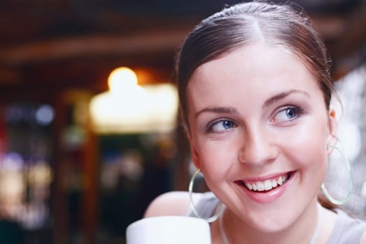 Close-up of a young woman smiling