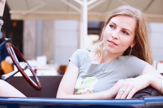 Close-up of a young woman in a car