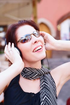 Close-up of a young woman wearing headphones