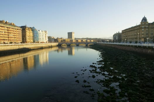 Buildings on the both sides of a river, Spain