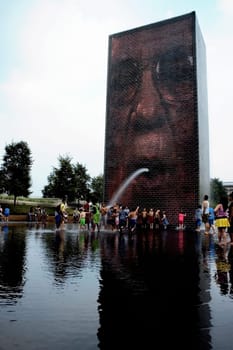 Group of people playing in water, Crown Fountain, Millennium Park, Chicago, Illinois, USA