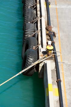 Close-up of a rope tied up with a bollard