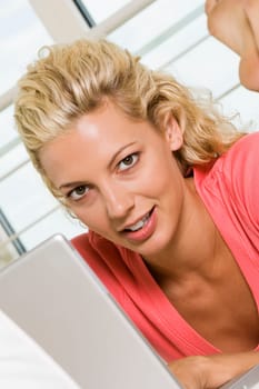 Portrait of a young woman working on a laptop