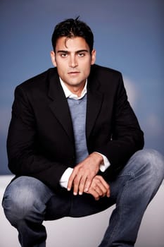 Portrait of a young man crouching
