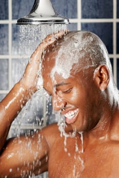 Close-up of a young man in the shower