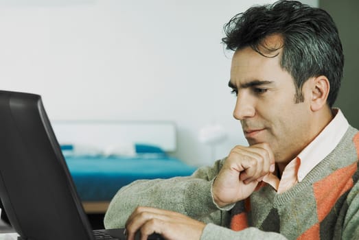 Close-up of a mature man using a laptop