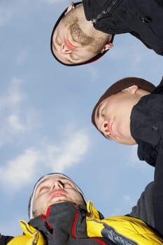 Low angle view of three young men