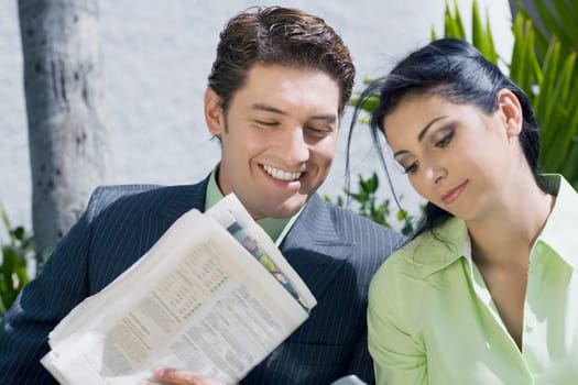 Close-up of a businessman with a businesswoman and smiling