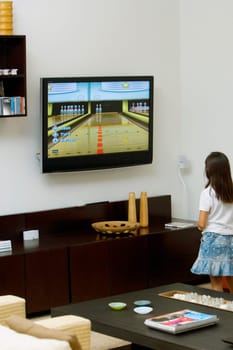 Rear view of a girl watching television