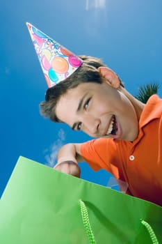 Portrait of a boy with a gift bag