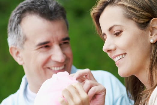 Close-up of a mid adult couple eating cotton candy