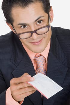 Portrait of a businessman holding a check