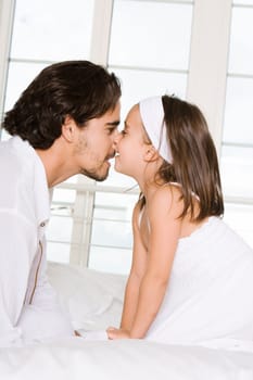 Side profile of a father looking at his daughter