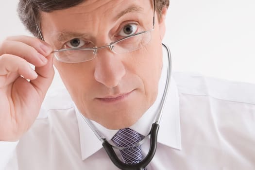 Close_up of a male doctor looking worried