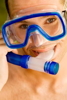 Portrait of a young man wearing a snorkel