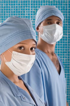 Close_up of a female surgeon and a male surgeon