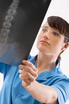 Female surgeon examining an X_Ray