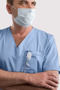 Male surgeon wearing a surgical mask