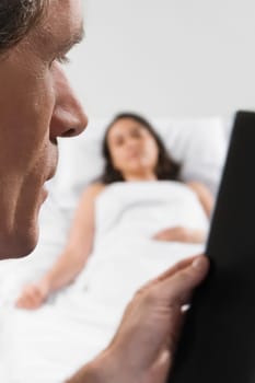 Male doctor examining an X_Ray report