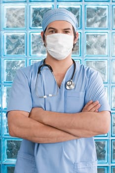 Male surgeon wearing a surgical mask