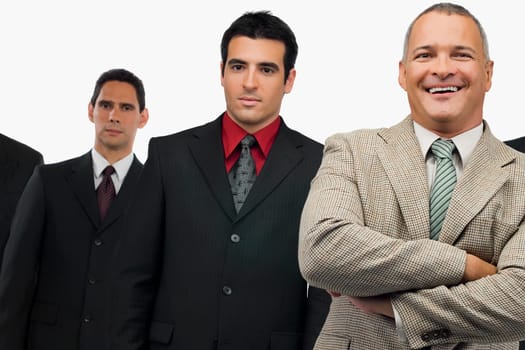 Portrait of a businessman smiling and three businessmen standing behind him