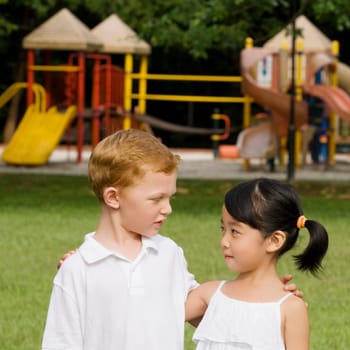 Close_up of a boy and a girl looking at each other